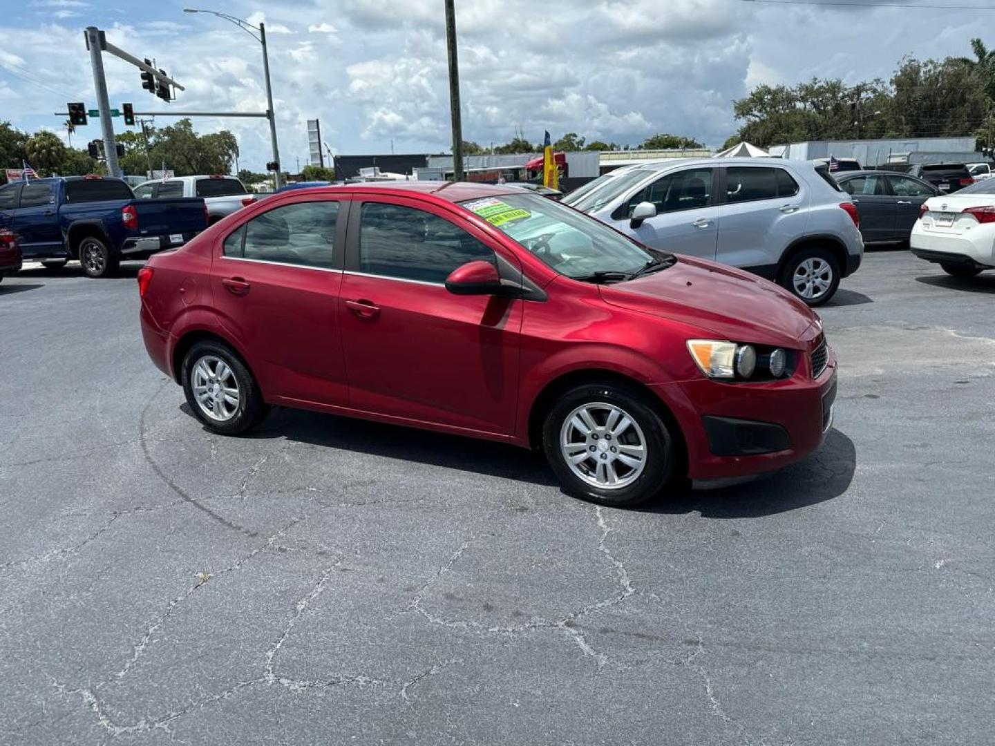 2013 RED CHEVROLET SONIC LT (1G1JC5SH2D4) with an 1.8L engine, Automatic transmission, located at 2929 9th St. West, Bradenton, 34205, (941) 242-2810, 27.473591, -82.570679 - Photo#1