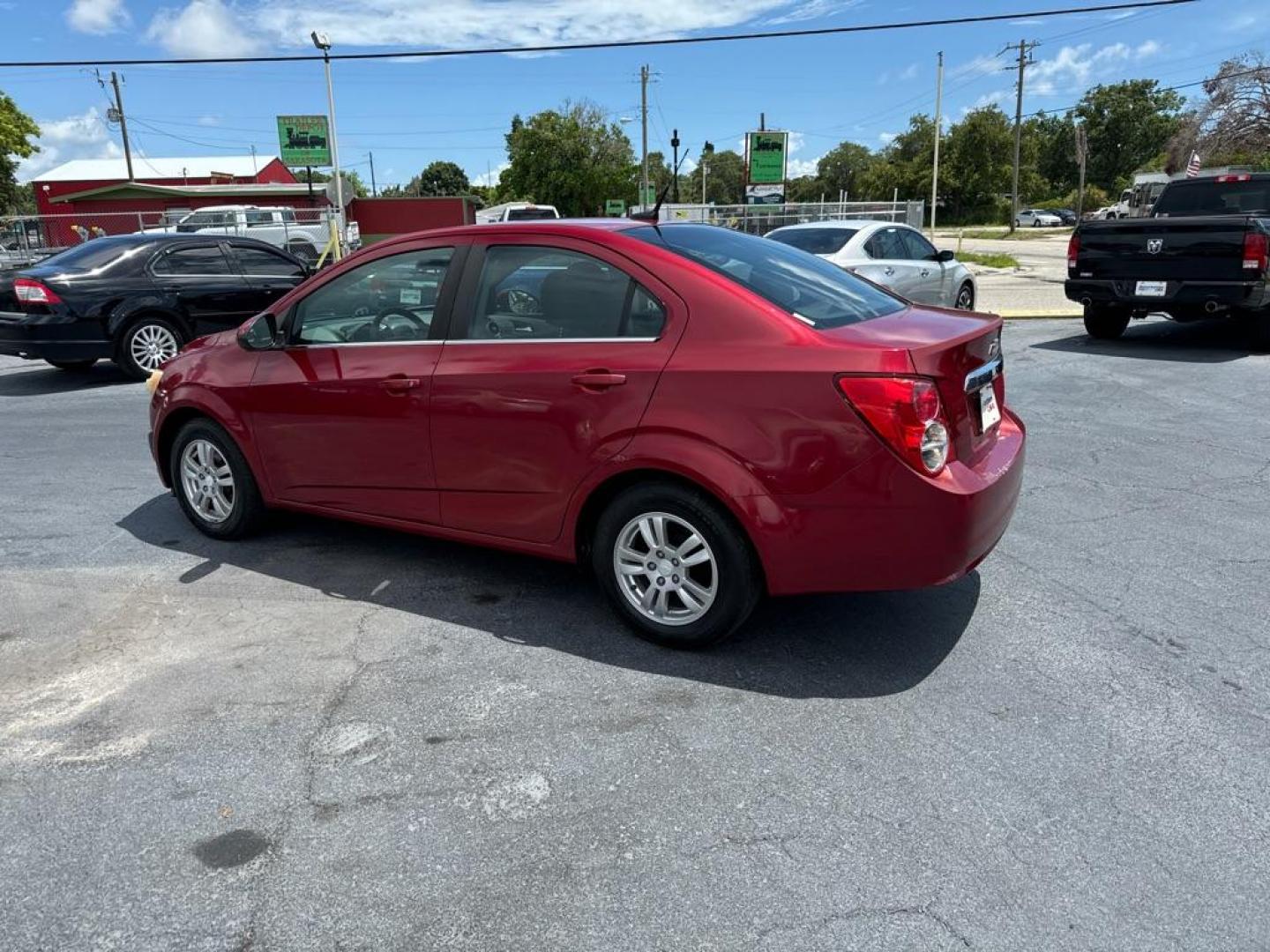 2013 RED CHEVROLET SONIC LT (1G1JC5SH2D4) with an 1.8L engine, Automatic transmission, located at 2929 9th St. West, Bradenton, 34205, (941) 242-2810, 27.473591, -82.570679 - Photo#4