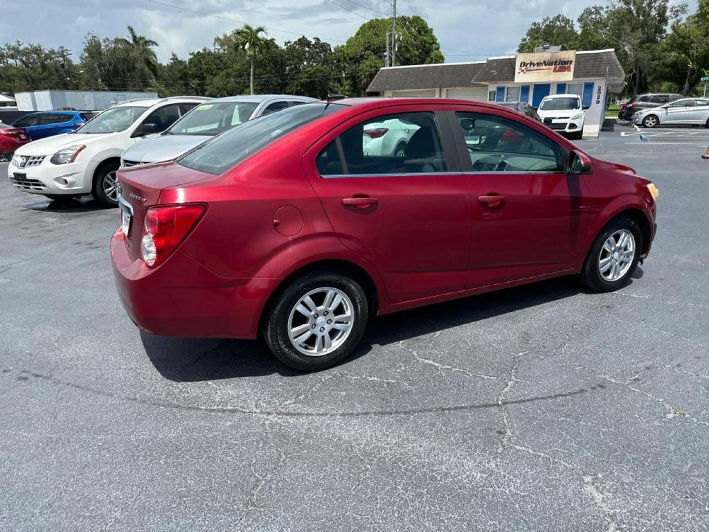 2013 RED CHEVROLET SONIC LT (1G1JC5SH2D4) with an 1.8L engine, Automatic transmission, located at 2929 9th St. West, Bradenton, 34205, (941) 242-2810, 27.473591, -82.570679 - Photo#6