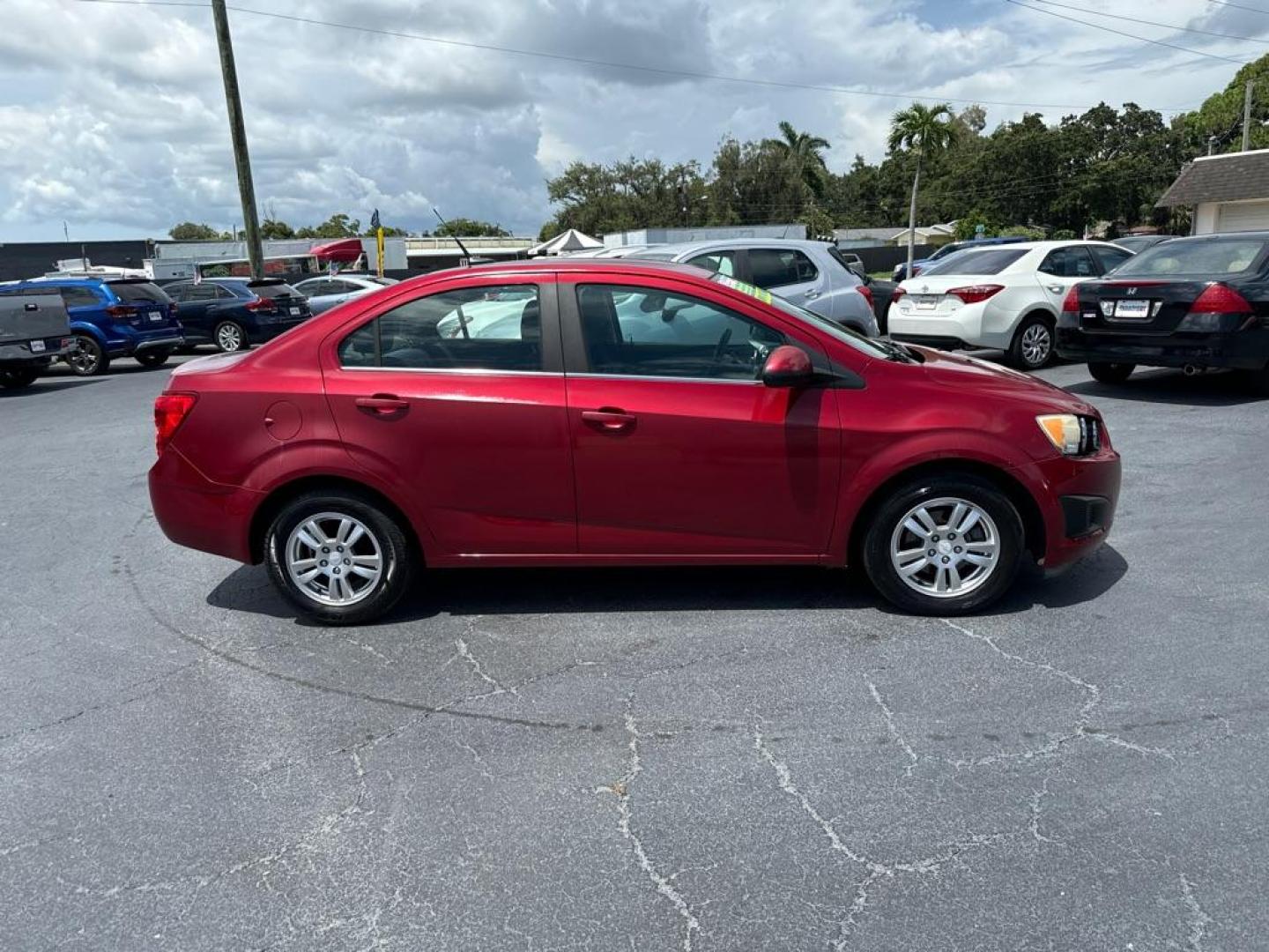 2013 RED CHEVROLET SONIC LT (1G1JC5SH2D4) with an 1.8L engine, Automatic transmission, located at 2929 9th St. West, Bradenton, 34205, (941) 242-2810, 27.473591, -82.570679 - Photo#7