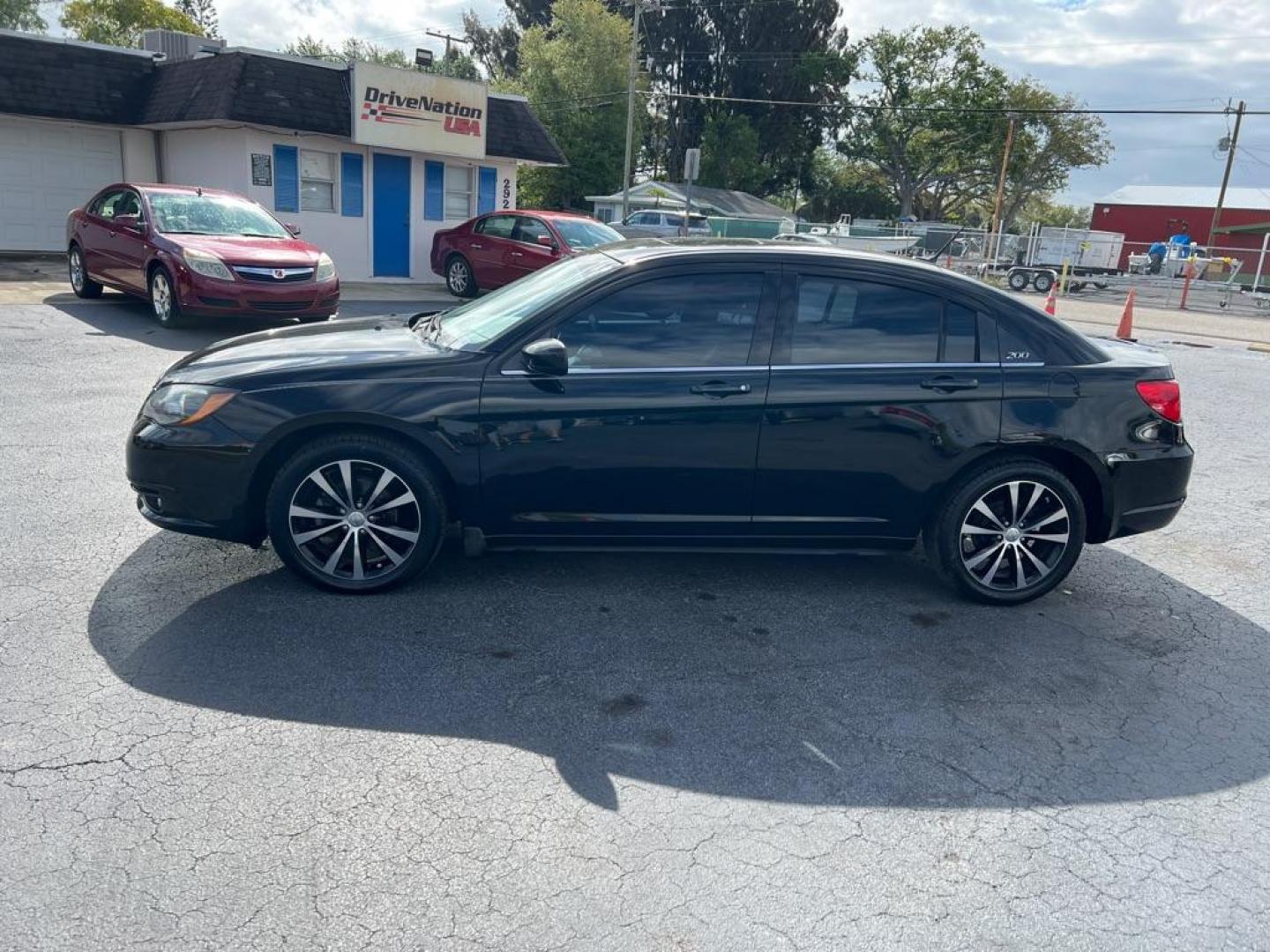 2013 BLACK CHRYSLER 200 TOURING (1C3CCBBB3DN) with an 2.4L engine, Automatic transmission, located at 2929 9th St. West, Bradenton, 34205, (941) 242-2810, 27.473591, -82.570679 - Thanks for inquring into DriveNation USA! All vehicles listed can be viewed at www.drivenationusa.com for vehicle history reports and additonal info. We cannot quote any terms such as down payments or monthly payments without an application. You can apply directly at www.drivenationusa.com or by con - Photo#5