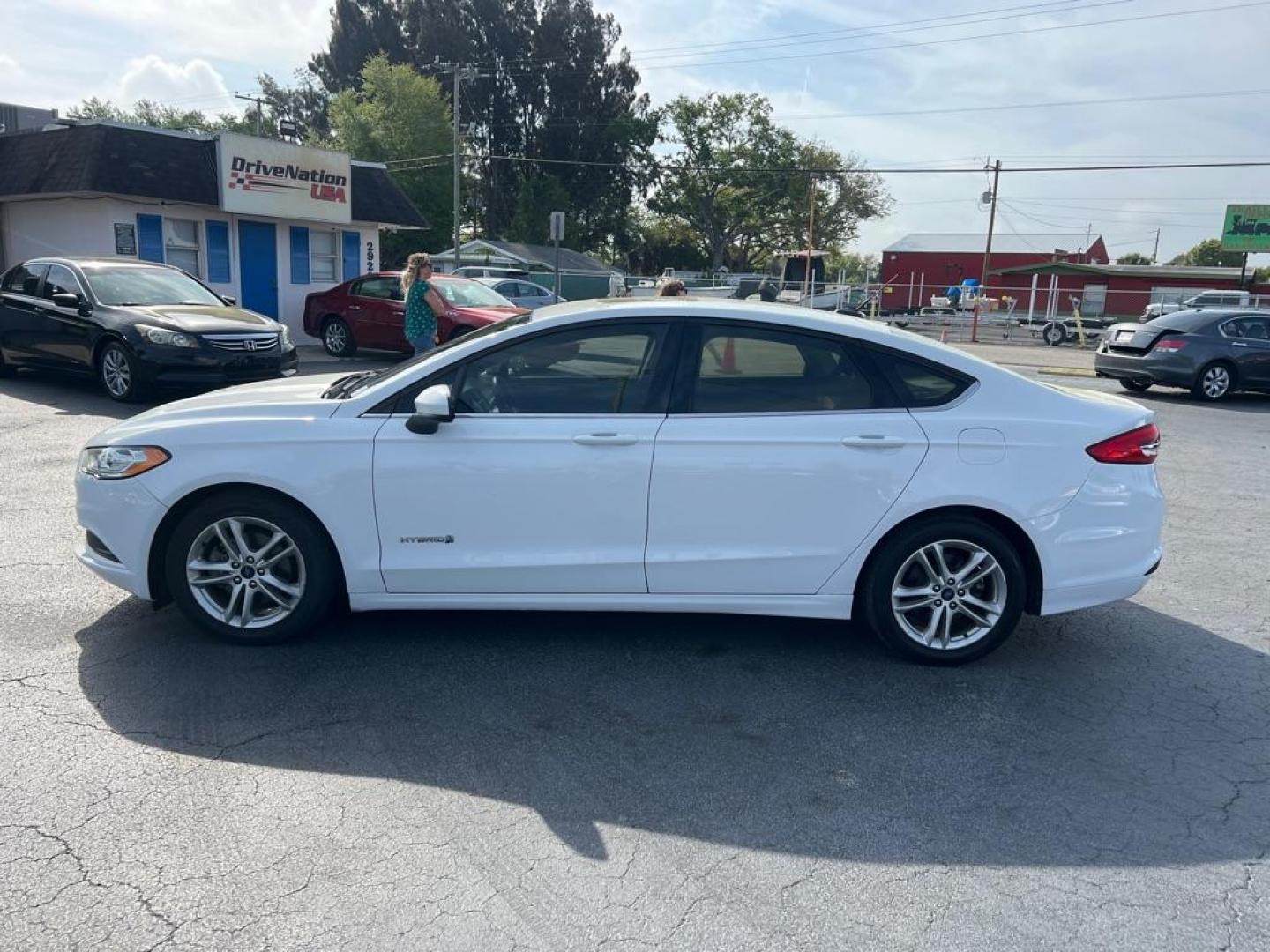 2018 WHITE FORD FUSION SE HYBRID (3FA6P0LU1JR) with an 2.0L engine, Continuously Variable transmission, located at 2929 9th St. West, Bradenton, 34205, (941) 242-2810, 27.473591, -82.570679 - Thanks for inquring into DriveNation USA! All vehicles listed can be viewed at www.drivenationusa.com for vehicle history reports and additonal info. We cannot quote any terms such as down payments or monthly payments without an application. You can apply directly at www.drivenationusa.com or by con - Photo#4