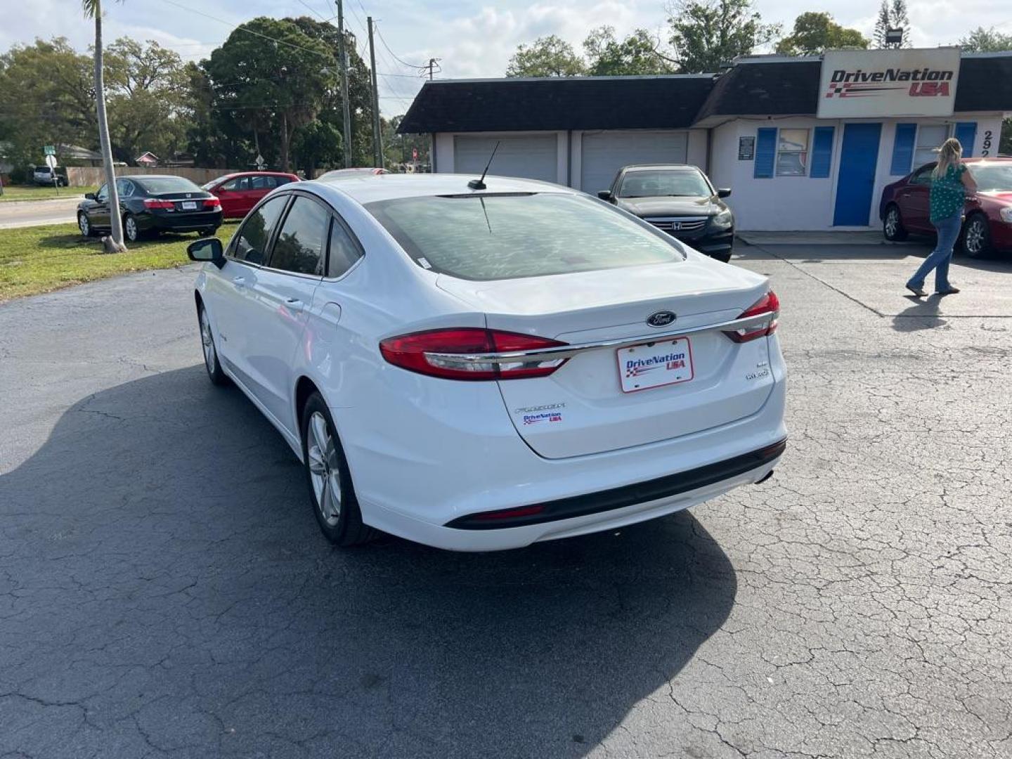 2018 WHITE FORD FUSION SE HYBRID (3FA6P0LU1JR) with an 2.0L engine, Continuously Variable transmission, located at 2929 9th St. West, Bradenton, 34205, (941) 242-2810, 27.473591, -82.570679 - Thanks for inquring into DriveNation USA! All vehicles listed can be viewed at www.drivenationusa.com for vehicle history reports and additonal info. We cannot quote any terms such as down payments or monthly payments without an application. You can apply directly at www.drivenationusa.com or by con - Photo#5