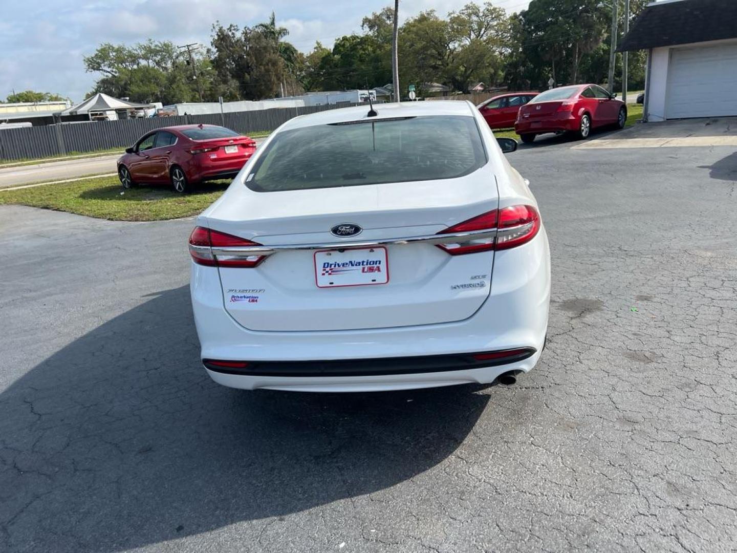 2018 WHITE FORD FUSION SE HYBRID (3FA6P0LU1JR) with an 2.0L engine, Continuously Variable transmission, located at 2929 9th St. West, Bradenton, 34205, (941) 242-2810, 27.473591, -82.570679 - Thanks for inquring into DriveNation USA! All vehicles listed can be viewed at www.drivenationusa.com for vehicle history reports and additonal info. We cannot quote any terms such as down payments or monthly payments without an application. You can apply directly at www.drivenationusa.com or by con - Photo#6