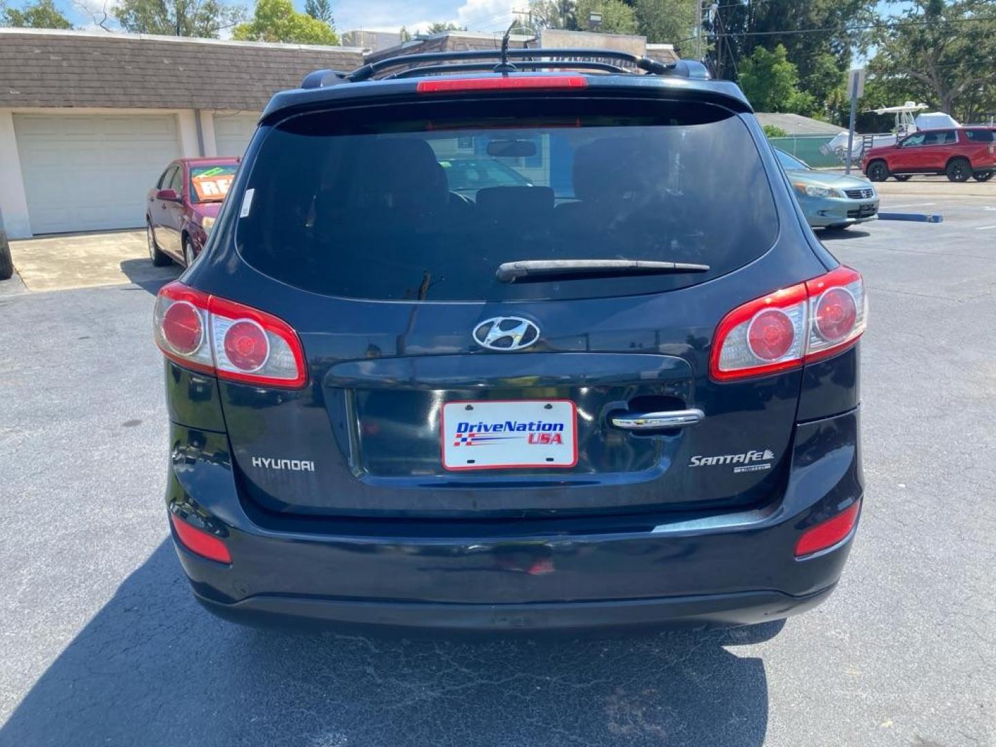 2010 BLACK HYUNDAI SANTA FE LIMITED (5NMSK3AB5AH) with an 2.4L engine, Automatic transmission, located at 2929 9th St. West, Bradenton, 34205, (941) 242-2810, 27.473591, -82.570679 - Thanks for inquring into DriveNation USA! All vehicles listed can be viewed at www.drivenationusa.com for vehicle history reports and additonal info. We cannot quote any terms such as down payments or monthly payments without an application. You can apply directly at www.drivenationusa.com or by con - Photo#4