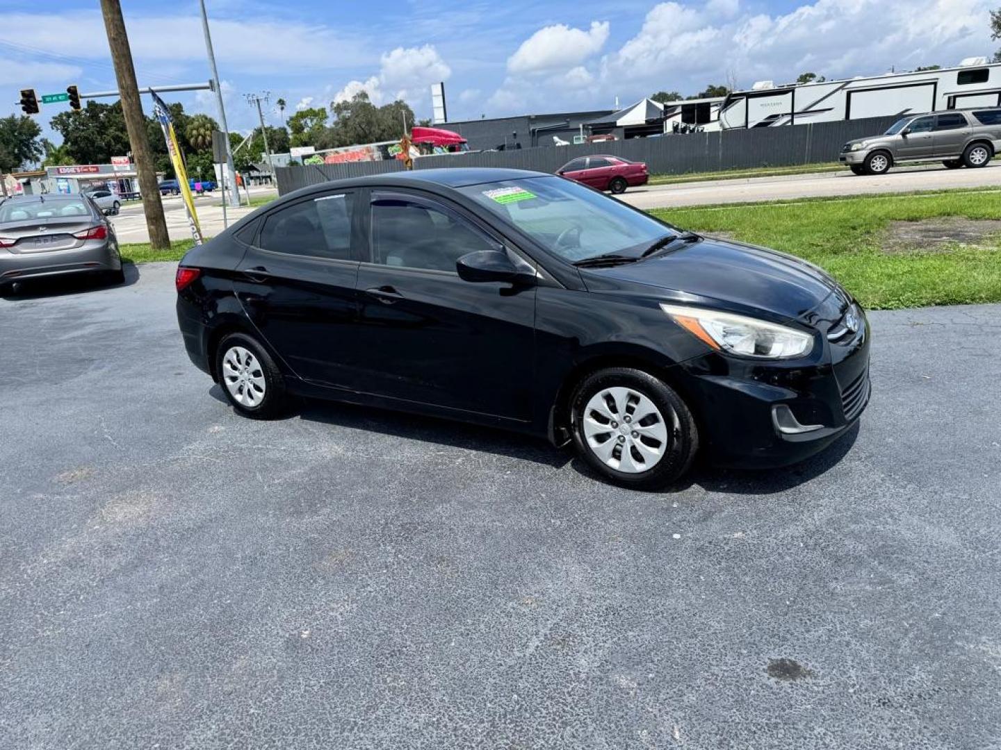 2016 BLACK HYUNDAI ACCENT SE (KMHCT4AE9GU) with an 1.6L engine, Automatic transmission, located at 2929 9th St. West, Bradenton, 34205, (941) 242-2810, 27.473591, -82.570679 - Photo#0