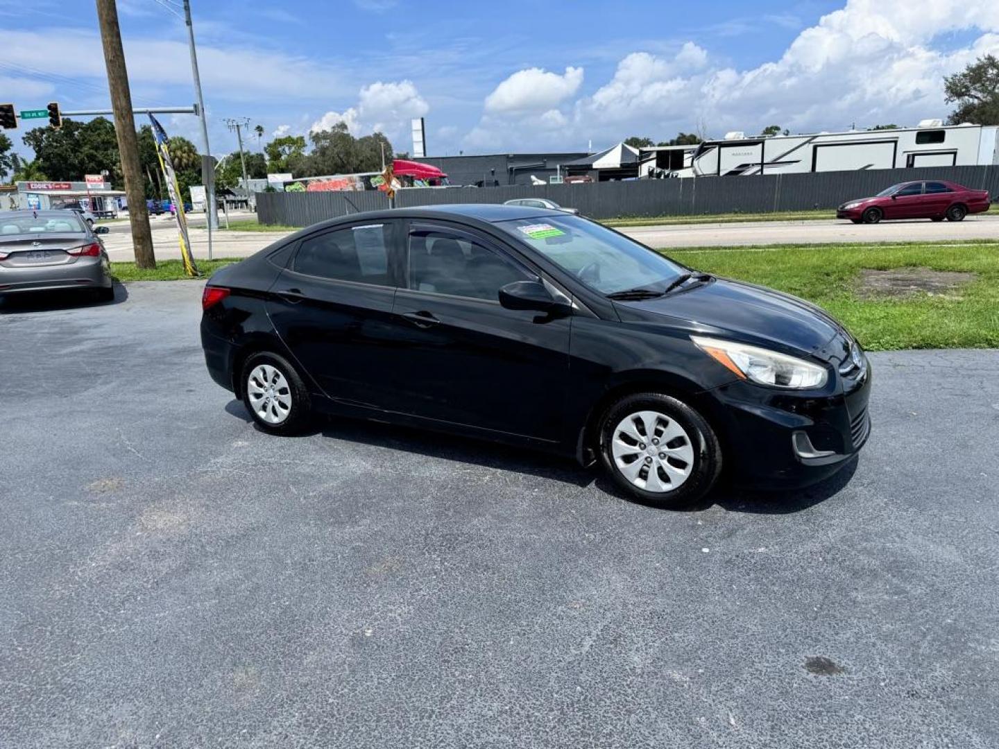 2016 BLACK HYUNDAI ACCENT SE (KMHCT4AE9GU) with an 1.6L engine, Automatic transmission, located at 2929 9th St. West, Bradenton, 34205, (941) 242-2810, 27.473591, -82.570679 - Photo#2