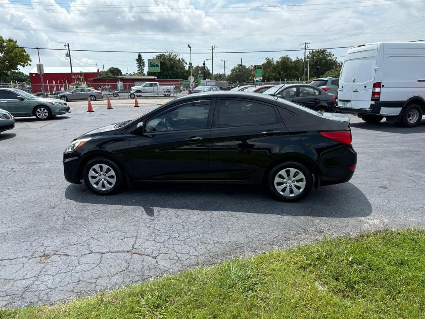 2016 BLACK HYUNDAI ACCENT SE (KMHCT4AE9GU) with an 1.6L engine, Automatic transmission, located at 2929 9th St. West, Bradenton, 34205, (941) 242-2810, 27.473591, -82.570679 - Photo#5