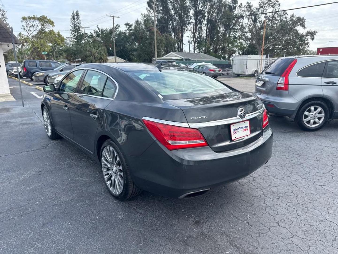 2014 BLACK BUICK LACROSSE TOURING (1G4GF5G34EF) with an 3.6L engine, Automatic transmission, located at 2929 9th St. West, Bradenton, 34205, (941) 242-2810, 27.473591, -82.570679 - Thanks for inquring into DriveNation USA! All vehicles listed can be viewed at www.drivenationusa.com for vehicle history reports and additonal info. We cannot quote any terms such as down payments or monthly payments without an application. You can apply directly at www.drivenationusa.com or by con - Photo#5