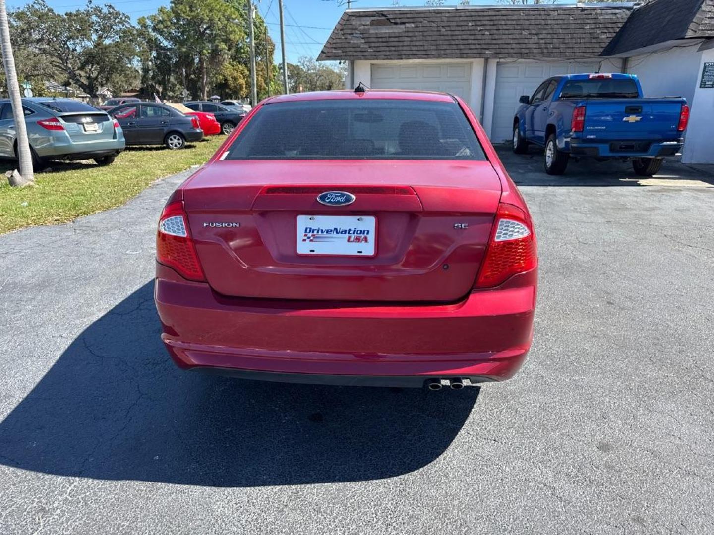 2012 RED FORD FUSION SE (3FAHP0HA6CR) with an 2.5L engine, Automatic transmission, located at 2929 9th St. West, Bradenton, 34205, (941) 242-2810, 27.473591, -82.570679 - Photo#6