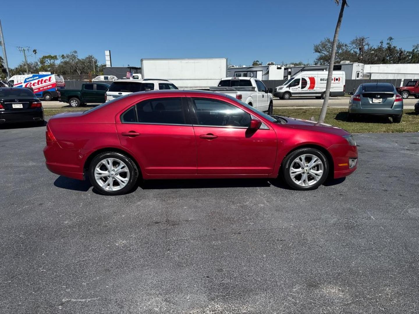 2012 RED FORD FUSION SE (3FAHP0HA6CR) with an 2.5L engine, Automatic transmission, located at 2929 9th St. West, Bradenton, 34205, (941) 242-2810, 27.473591, -82.570679 - Photo#8