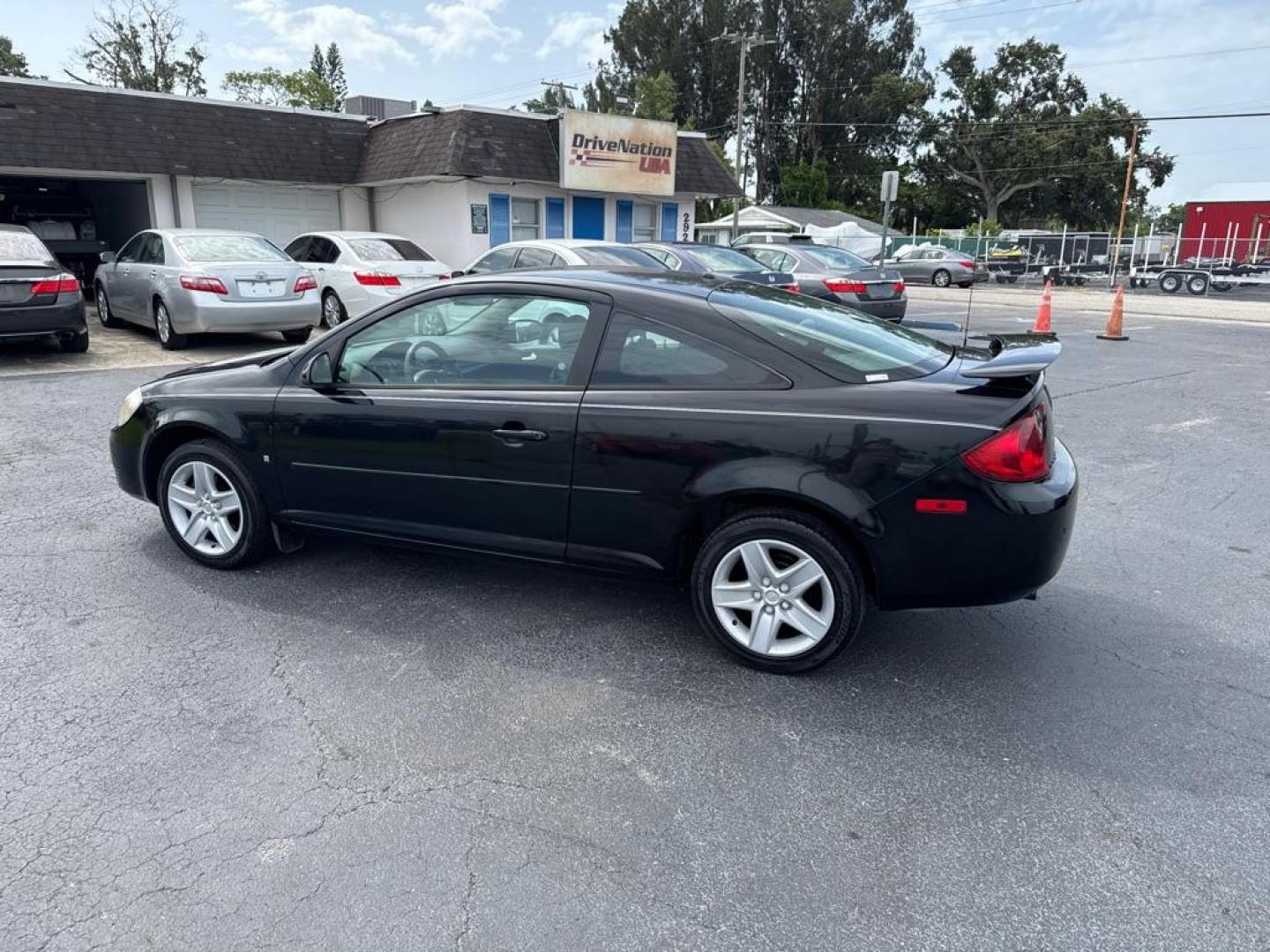 2007 BLACK PONTIAC G5 COUPE (1G2AL15F077) with an 2.2L engine, Automatic transmission, located at 2929 9th St. West, Bradenton, 34205, (941) 242-2810, 27.473591, -82.570679 - Thanks for inquring into DriveNation USA! All vehicles listed can be viewed at www.drivenationusa.com for vehicle history reports and additonal info. We cannot quote any terms such as down payments or monthly payments without an application. You can apply directly at www.drivenationusa.com or by con - Photo#5