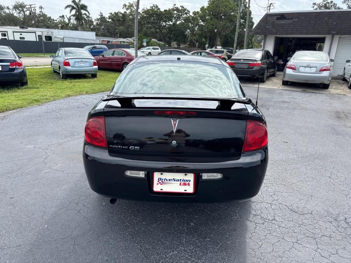 2007 BLACK PONTIAC G5 COUPE (1G2AL15F077) with an 2.2L engine, Automatic transmission, located at 2929 9th St. West, Bradenton, 34205, (941) 242-2810, 27.473591, -82.570679 - Thanks for inquring into DriveNation USA! All vehicles listed can be viewed at www.drivenationusa.com for vehicle history reports and additonal info. We cannot quote any terms such as down payments or monthly payments without an application. You can apply directly at www.drivenationusa.com or by con - Photo#6