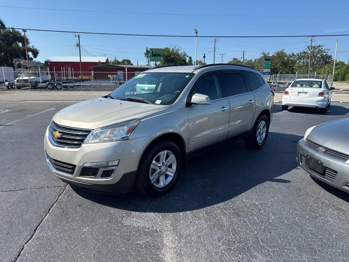 2014 GOLD CHEVROLET TRAVERSE LT (1GNKRGKD0EJ) with an 3.6L engine, Automatic transmission, located at 2929 9th St. West, Bradenton, 34205, (941) 242-2810, 27.473591, -82.570679 - Thanks for inquring into DriveNation USA! All vehicles listed can be viewed at www.drivenationusa.com for vehicle history reports and additonal info. We cannot quote any terms such as down payments or monthly payments without an application. You can apply directly at www.drivenationusa.com or by con - Photo#3
