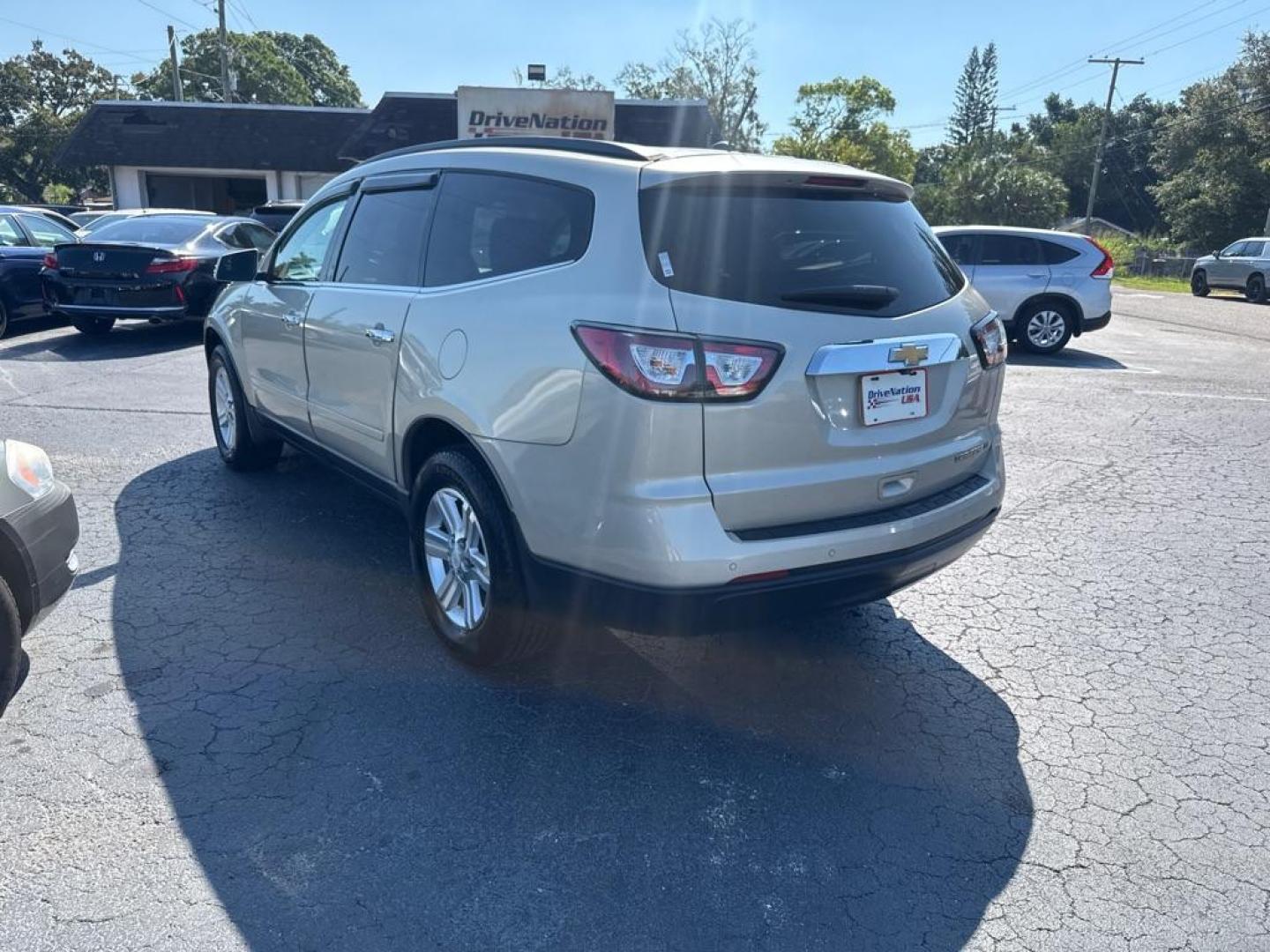 2014 GOLD CHEVROLET TRAVERSE LT (1GNKRGKD0EJ) with an 3.6L engine, Automatic transmission, located at 2929 9th St. West, Bradenton, 34205, (941) 242-2810, 27.473591, -82.570679 - Thanks for inquring into DriveNation USA! All vehicles listed can be viewed at www.drivenationusa.com for vehicle history reports and additonal info. We cannot quote any terms such as down payments or monthly payments without an application. You can apply directly at www.drivenationusa.com or by con - Photo#4