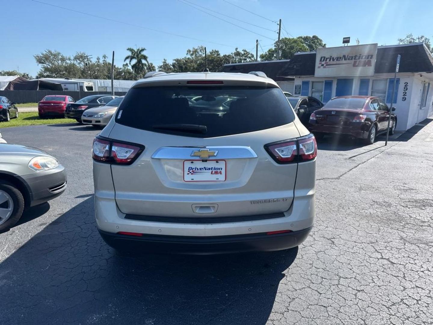 2014 GOLD CHEVROLET TRAVERSE LT (1GNKRGKD0EJ) with an 3.6L engine, Automatic transmission, located at 2929 9th St. West, Bradenton, 34205, (941) 242-2810, 27.473591, -82.570679 - Thanks for inquring into DriveNation USA! All vehicles listed can be viewed at www.drivenationusa.com for vehicle history reports and additonal info. We cannot quote any terms such as down payments or monthly payments without an application. You can apply directly at www.drivenationusa.com or by con - Photo#5