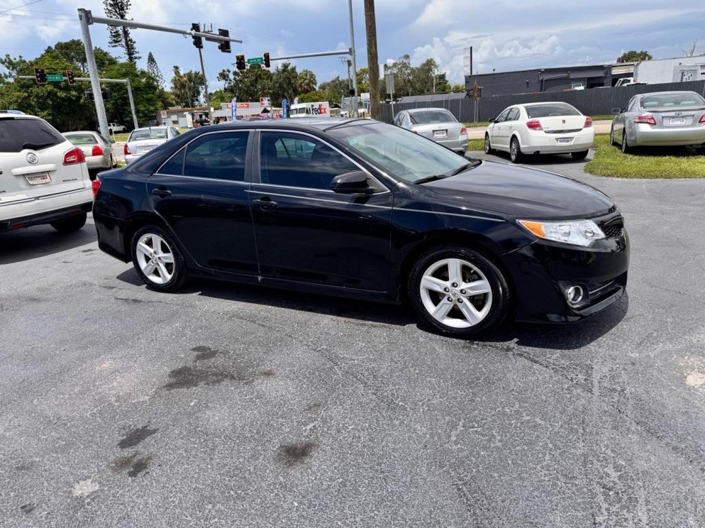 2014 BLACK TOYOTA CAMRY SE (4T1BF1FKXEU) with an 2.5L engine, Automatic transmission, located at 2929 9th St. West, Bradenton, 34205, (941) 242-2810, 27.473591, -82.570679 - Thanks for inquring into DriveNation USA! All vehicles listed can be viewed at www.drivenationusa.com for vehicle history reports and additonal info. We cannot quote any terms such as down payments or monthly payments without an application. You can apply directly at www.drivenationusa.com or by con - Photo#1