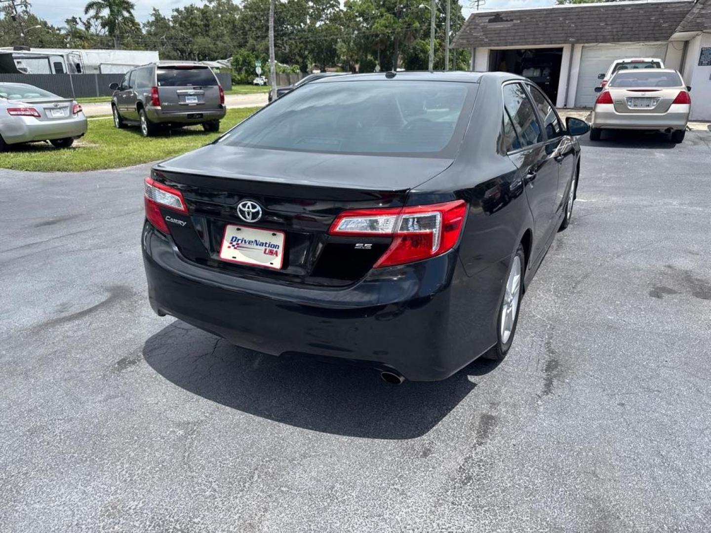 2014 BLACK TOYOTA CAMRY SE (4T1BF1FKXEU) with an 2.5L engine, Automatic transmission, located at 2929 9th St. West, Bradenton, 34205, (941) 242-2810, 27.473591, -82.570679 - Thanks for inquring into DriveNation USA! All vehicles listed can be viewed at www.drivenationusa.com for vehicle history reports and additonal info. We cannot quote any terms such as down payments or monthly payments without an application. You can apply directly at www.drivenationusa.com or by con - Photo#7