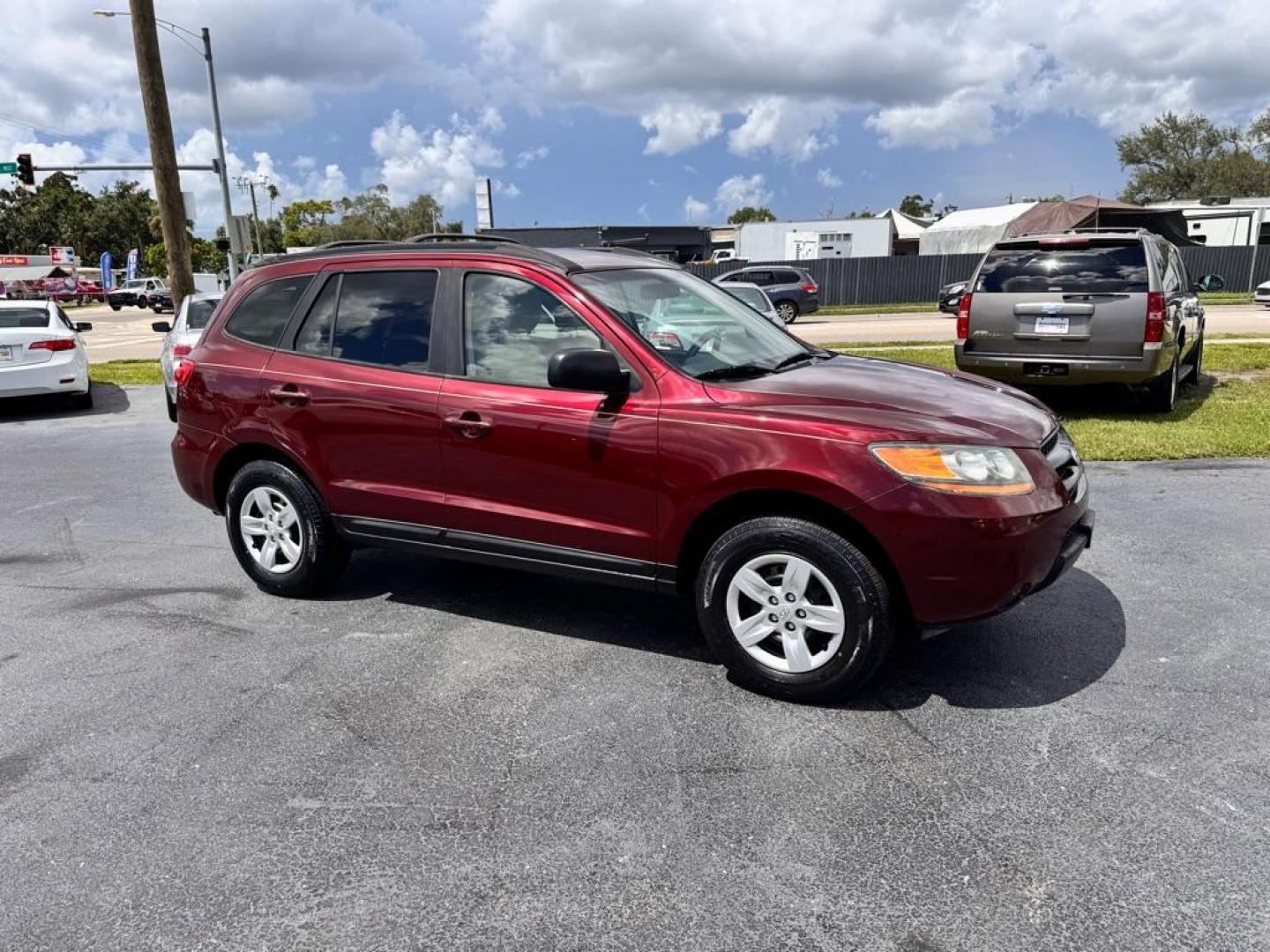 2009 RED HYUNDAI SANTA FE GLS (5NMSG13D39H) with an 2.7L engine, Automatic transmission, located at 2929 9th St. West, Bradenton, 34205, (941) 242-2810, 27.473591, -82.570679 - Thanks for inquring into DriveNation USA! All vehicles listed can be viewed at www.drivenationusa.com for vehicle history reports and additonal info. We cannot quote any terms such as down payments or monthly payments without an application. You can apply directly at www.drivenationusa.com or by con - Photo#2