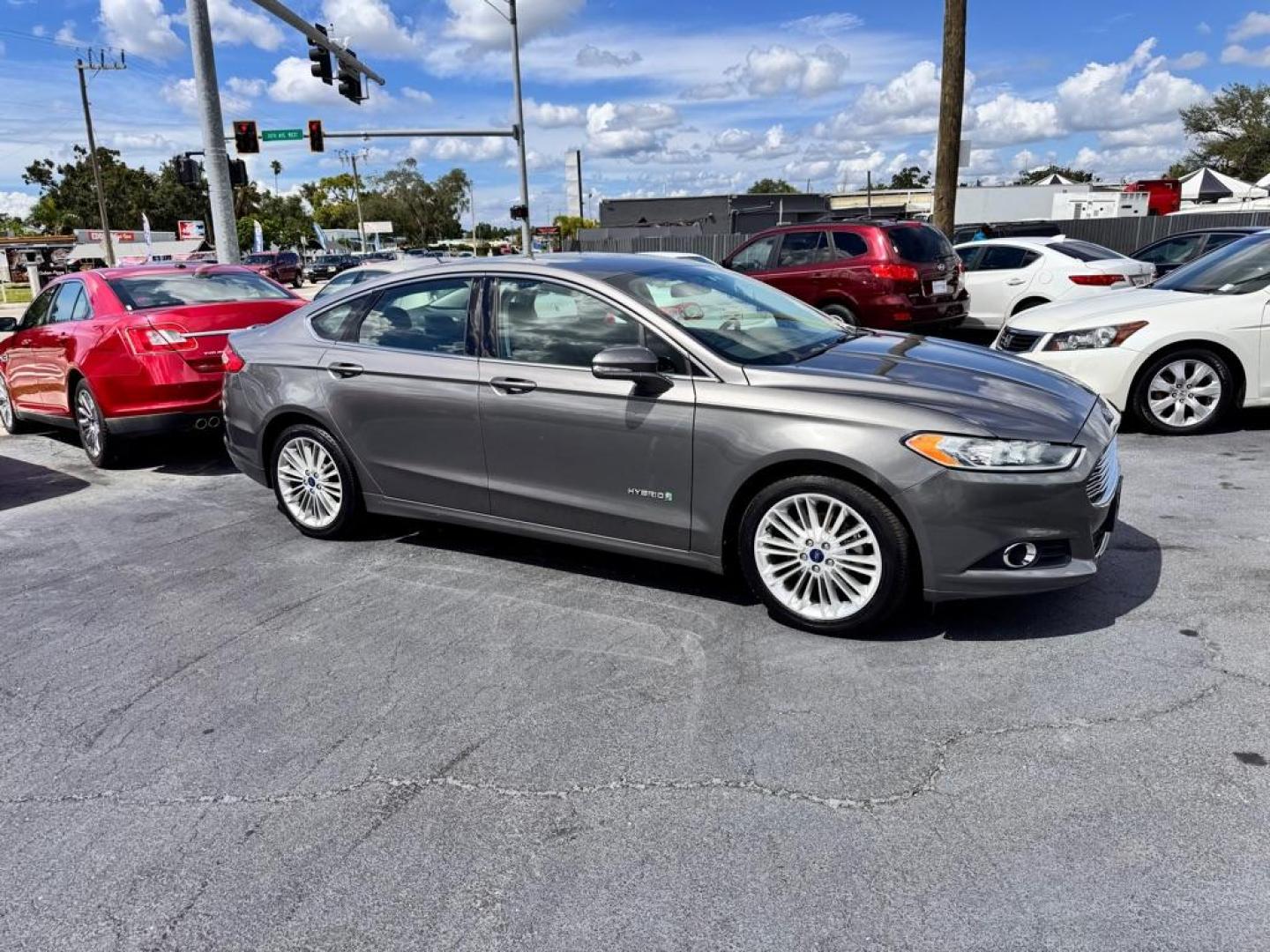 2014 GRAY FORD FUSION SE HYBRID (3FA6P0LU9ER) with an 2.0L engine, Continuously Variable transmission, located at 2929 9th St. West, Bradenton, 34205, (941) 242-2810, 27.473591, -82.570679 - Thanks for inquring into DriveNation USA! All vehicles listed can be viewed at www.drivenationusa.com for vehicle history reports and additonal info. We cannot quote any terms such as down payments or monthly payments without an application. You can apply directly at www.drivenationusa.com or by con - Photo#1