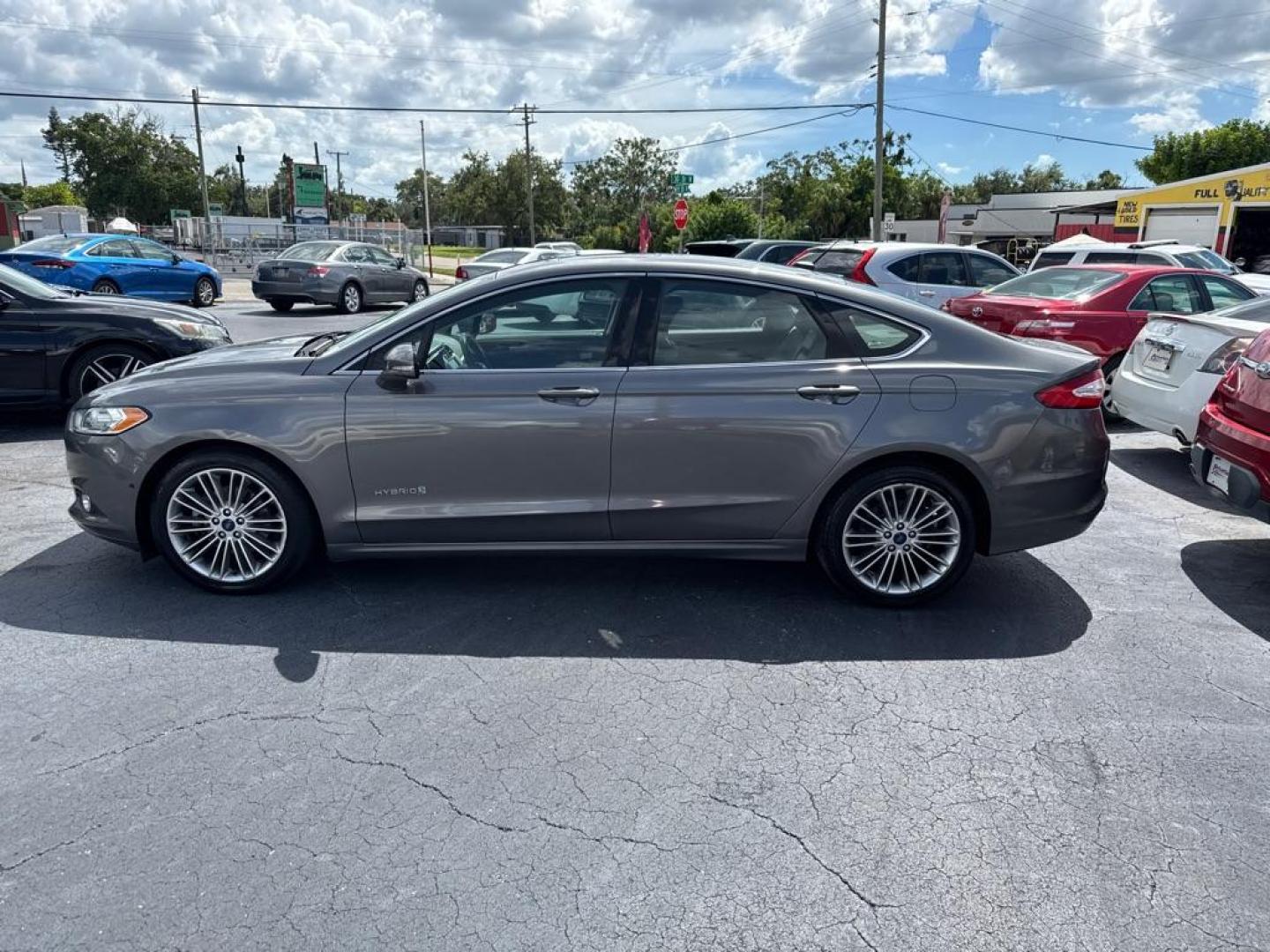 2014 GRAY FORD FUSION SE HYBRID (3FA6P0LU9ER) with an 2.0L engine, Continuously Variable transmission, located at 2929 9th St. West, Bradenton, 34205, (941) 242-2810, 27.473591, -82.570679 - Thanks for inquring into DriveNation USA! All vehicles listed can be viewed at www.drivenationusa.com for vehicle history reports and additonal info. We cannot quote any terms such as down payments or monthly payments without an application. You can apply directly at www.drivenationusa.com or by con - Photo#4