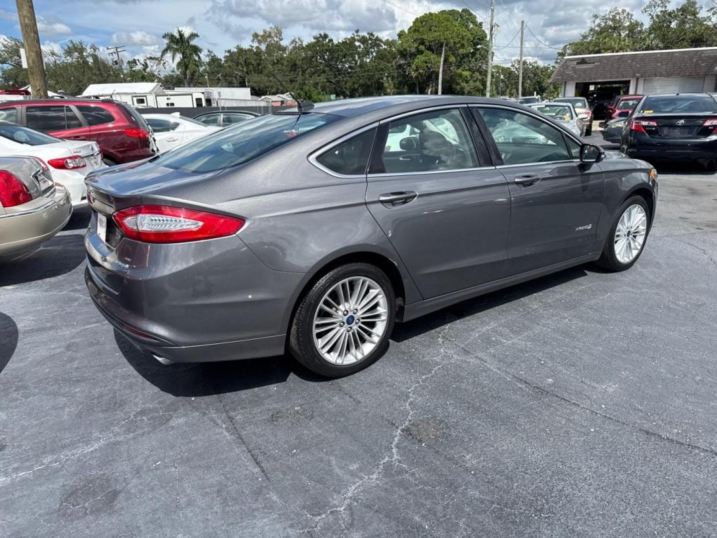 2014 GRAY FORD FUSION SE HYBRID (3FA6P0LU9ER) with an 2.0L engine, Continuously Variable transmission, located at 2929 9th St. West, Bradenton, 34205, (941) 242-2810, 27.473591, -82.570679 - Thanks for inquring into DriveNation USA! All vehicles listed can be viewed at www.drivenationusa.com for vehicle history reports and additonal info. We cannot quote any terms such as down payments or monthly payments without an application. You can apply directly at www.drivenationusa.com or by con - Photo#6