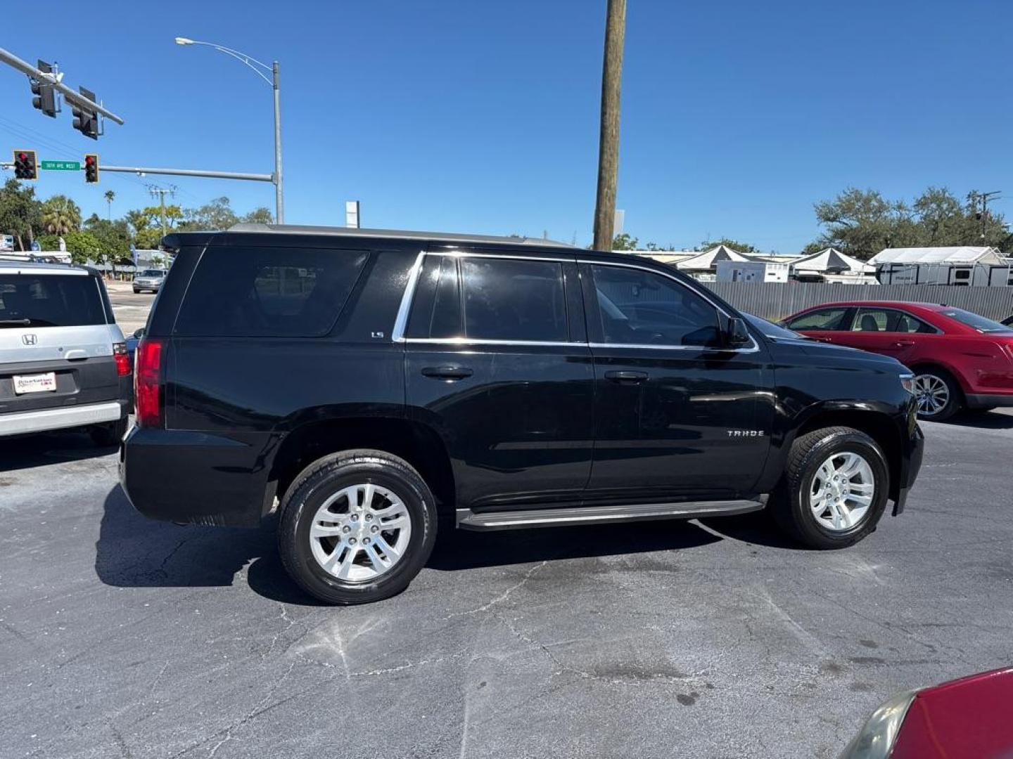 2016 BLACK CHEVROLET TAHOE 1500 LS (1GNSCAKC0GR) with an 5.3L engine, Automatic transmission, located at 2929 9th St. West, Bradenton, 34205, (941) 242-2810, 27.473591, -82.570679 - Photo#7