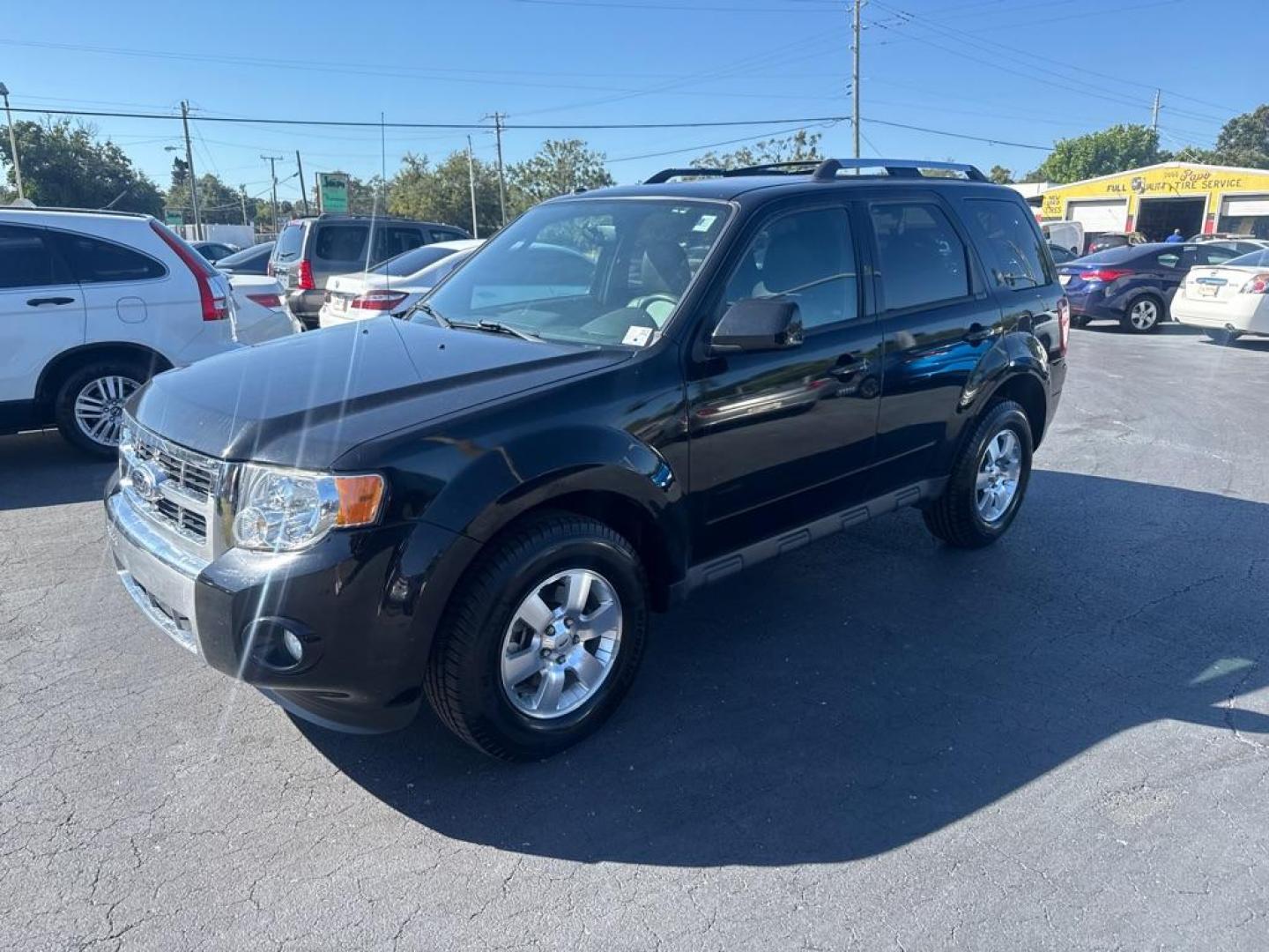 2012 BLACK FORD ESCAPE LIMITED (1FMCU0E72CK) with an 2.5L engine, Automatic transmission, located at 2929 9th St. West, Bradenton, 34205, (941) 242-2810, 27.473591, -82.570679 - Photo#4