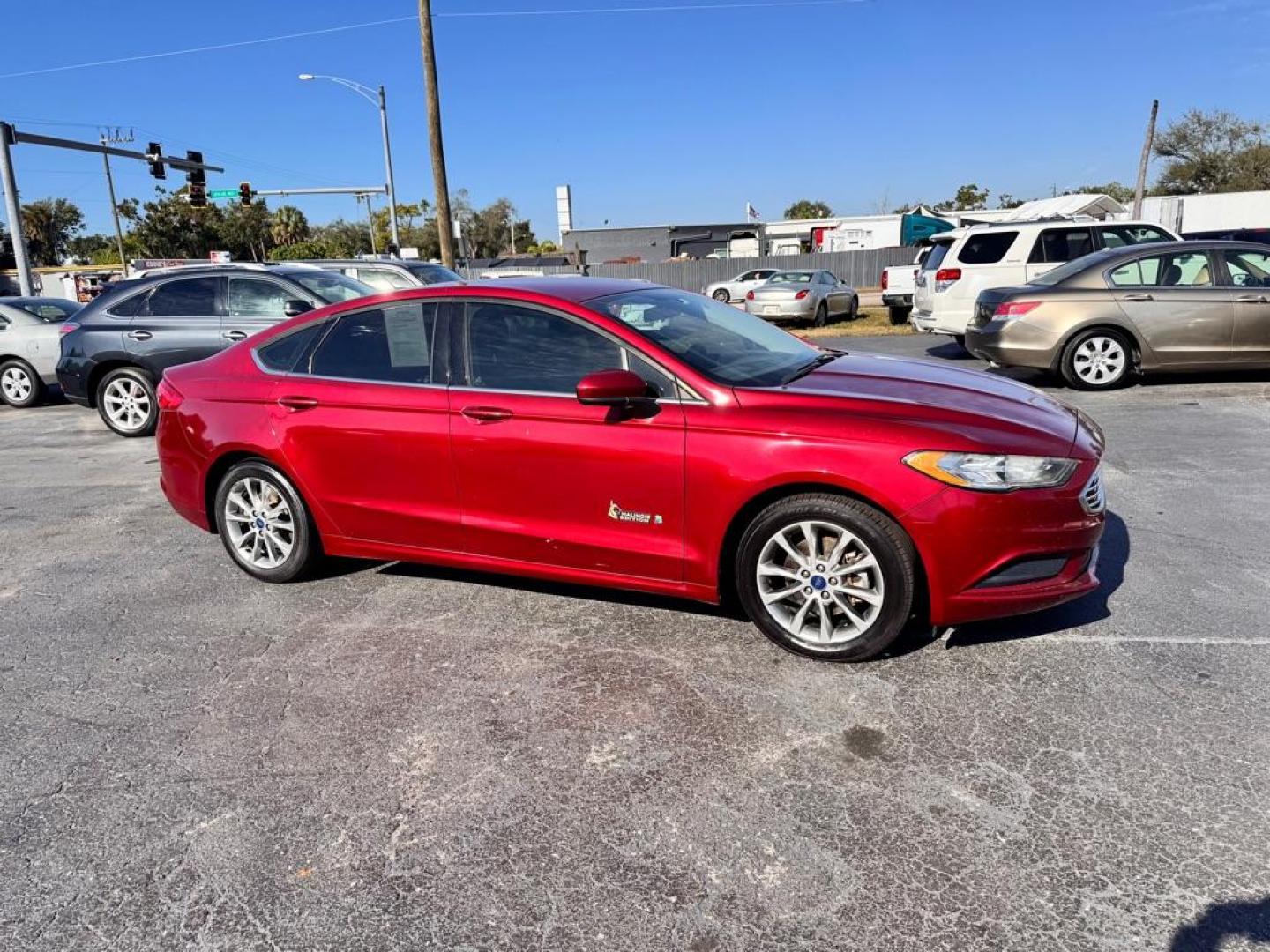 2017 RED FORD FUSION SE HYBRID (3FA6P0LU7HR) with an 2.0L engine, Continuously Variable transmission, located at 2929 9th St. West, Bradenton, 34205, (941) 242-2810, 27.473591, -82.570679 - Thanks for inquring into DriveNation USA! All vehicles listed can be viewed at www.drivenationusa.com for vehicle history reports and additonal info. We cannot quote any terms such as down payments or monthly payments without an application. You can apply directly at www.drivenationusa.com or by con - Photo#1