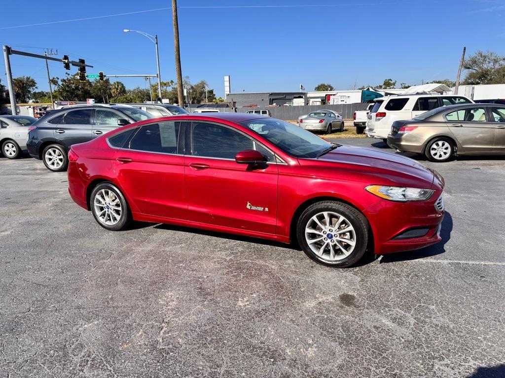 2017 RED FORD FUSION SE HYBRID (3FA6P0LU7HR) with an 2.0L engine, Continuously Variable transmission, located at 2929 9th St. West, Bradenton, 34205, (941) 242-2810, 27.473591, -82.570679 - Thanks for inquring into DriveNation USA! All vehicles listed can be viewed at www.drivenationusa.com for vehicle history reports and additonal info. We cannot quote any terms such as down payments or monthly payments without an application. You can apply directly at www.drivenationusa.com or by con - Photo#2
