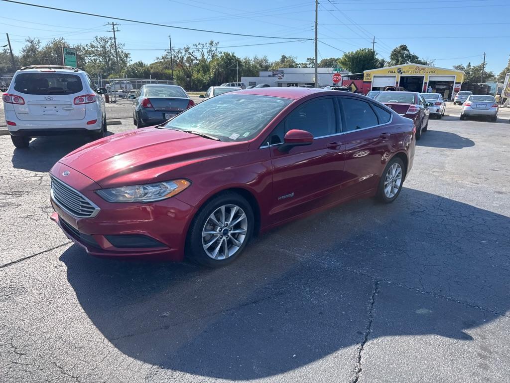 2017 RED FORD FUSION SE HYBRID (3FA6P0LU7HR) with an 2.0L engine, Continuously Variable transmission, located at 2929 9th St. West, Bradenton, 34205, (941) 242-2810, 27.473591, -82.570679 - Thanks for inquring into DriveNation USA! All vehicles listed can be viewed at www.drivenationusa.com for vehicle history reports and additonal info. We cannot quote any terms such as down payments or monthly payments without an application. You can apply directly at www.drivenationusa.com or by con - Photo#4
