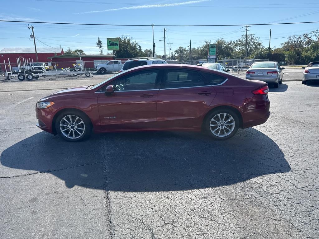 2017 RED FORD FUSION SE HYBRID (3FA6P0LU7HR) with an 2.0L engine, Continuously Variable transmission, located at 2929 9th St. West, Bradenton, 34205, (941) 242-2810, 27.473591, -82.570679 - Thanks for inquring into DriveNation USA! All vehicles listed can be viewed at www.drivenationusa.com for vehicle history reports and additonal info. We cannot quote any terms such as down payments or monthly payments without an application. You can apply directly at www.drivenationusa.com or by con - Photo#5