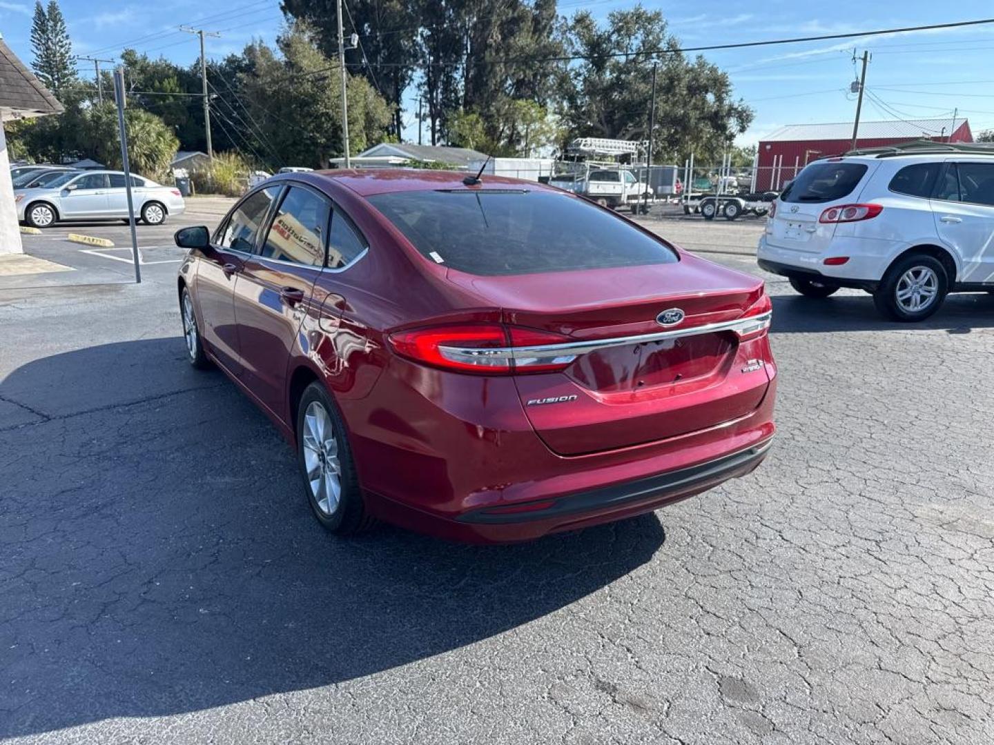 2017 RED FORD FUSION SE HYBRID (3FA6P0LU7HR) with an 2.0L engine, Continuously Variable transmission, located at 2929 9th St. West, Bradenton, 34205, (941) 242-2810, 27.473591, -82.570679 - Thanks for inquring into DriveNation USA! All vehicles listed can be viewed at www.drivenationusa.com for vehicle history reports and additonal info. We cannot quote any terms such as down payments or monthly payments without an application. You can apply directly at www.drivenationusa.com or by con - Photo#6