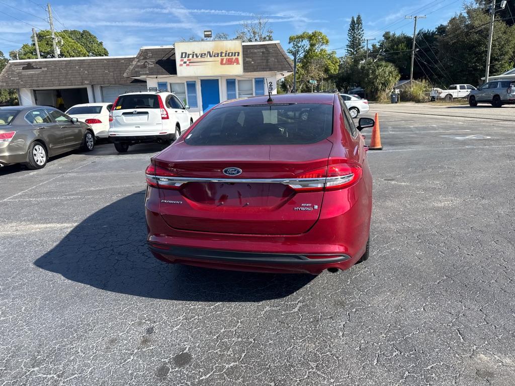 2017 RED FORD FUSION SE HYBRID (3FA6P0LU7HR) with an 2.0L engine, Continuously Variable transmission, located at 2929 9th St. West, Bradenton, 34205, (941) 242-2810, 27.473591, -82.570679 - Thanks for inquring into DriveNation USA! All vehicles listed can be viewed at www.drivenationusa.com for vehicle history reports and additonal info. We cannot quote any terms such as down payments or monthly payments without an application. You can apply directly at www.drivenationusa.com or by con - Photo#7