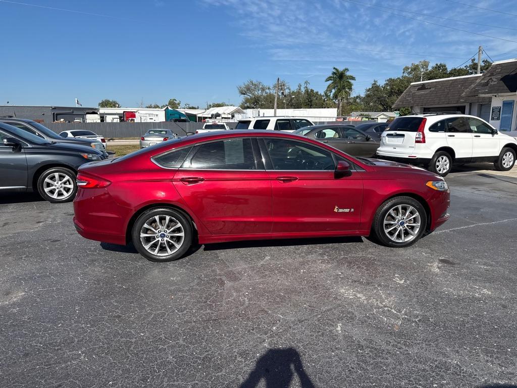 2017 RED FORD FUSION SE HYBRID (3FA6P0LU7HR) with an 2.0L engine, Continuously Variable transmission, located at 2929 9th St. West, Bradenton, 34205, (941) 242-2810, 27.473591, -82.570679 - Thanks for inquring into DriveNation USA! All vehicles listed can be viewed at www.drivenationusa.com for vehicle history reports and additonal info. We cannot quote any terms such as down payments or monthly payments without an application. You can apply directly at www.drivenationusa.com or by con - Photo#9