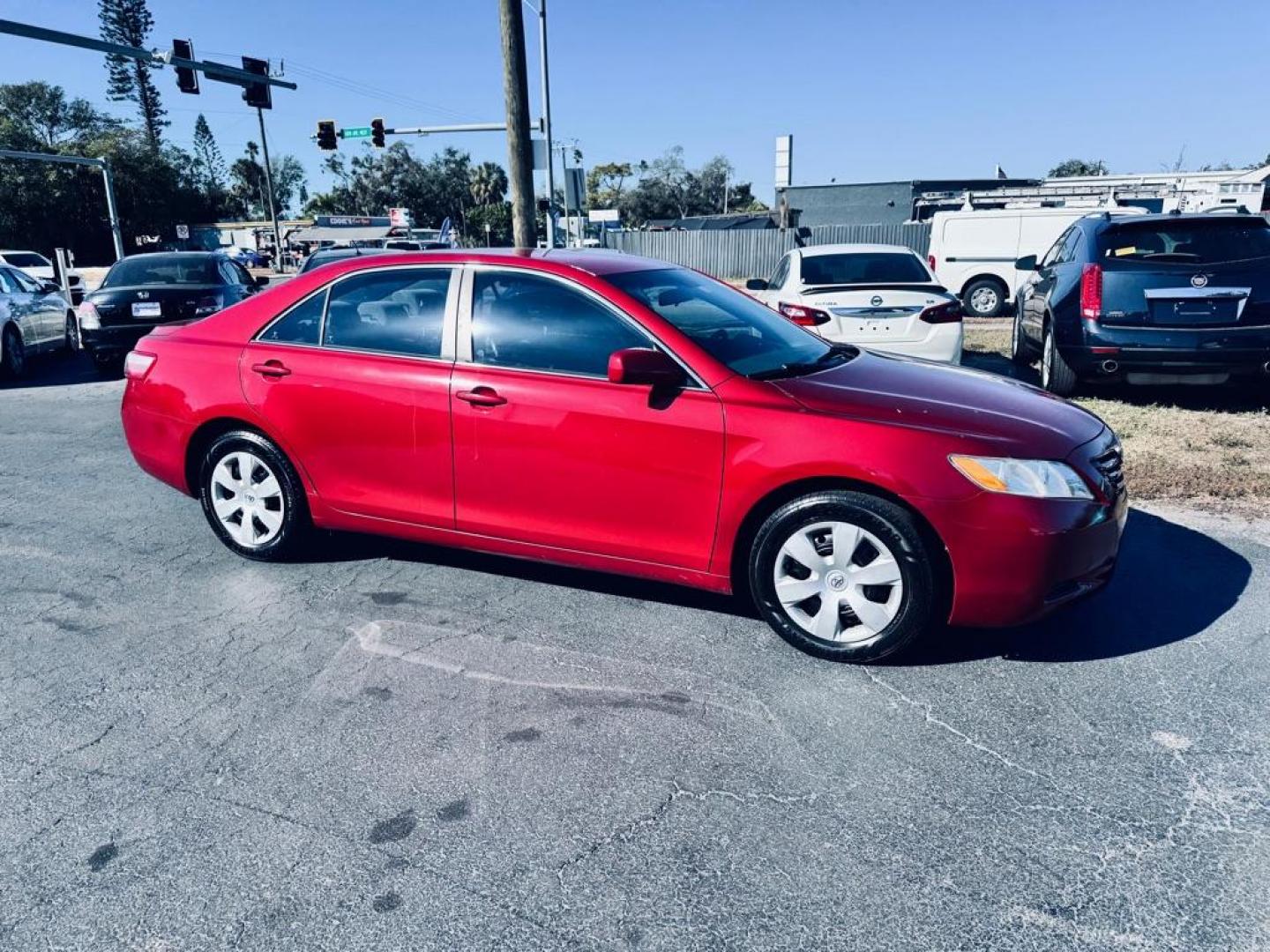 2009 RED TOYOTA CAMRY LE (4T1BE46K09U) with an 2.4L engine, Automatic transmission, located at 2929 9th St. West, Bradenton, 34205, (941) 242-2810, 27.473591, -82.570679 - Photo#0