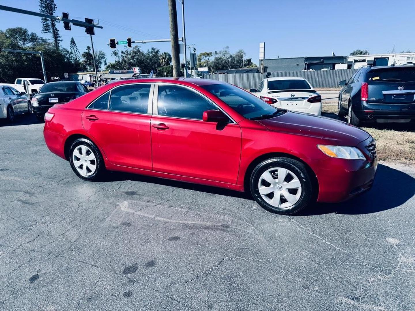 2009 RED TOYOTA CAMRY LE (4T1BE46K09U) with an 2.4L engine, Automatic transmission, located at 2929 9th St. West, Bradenton, 34205, (941) 242-2810, 27.473591, -82.570679 - Photo#1