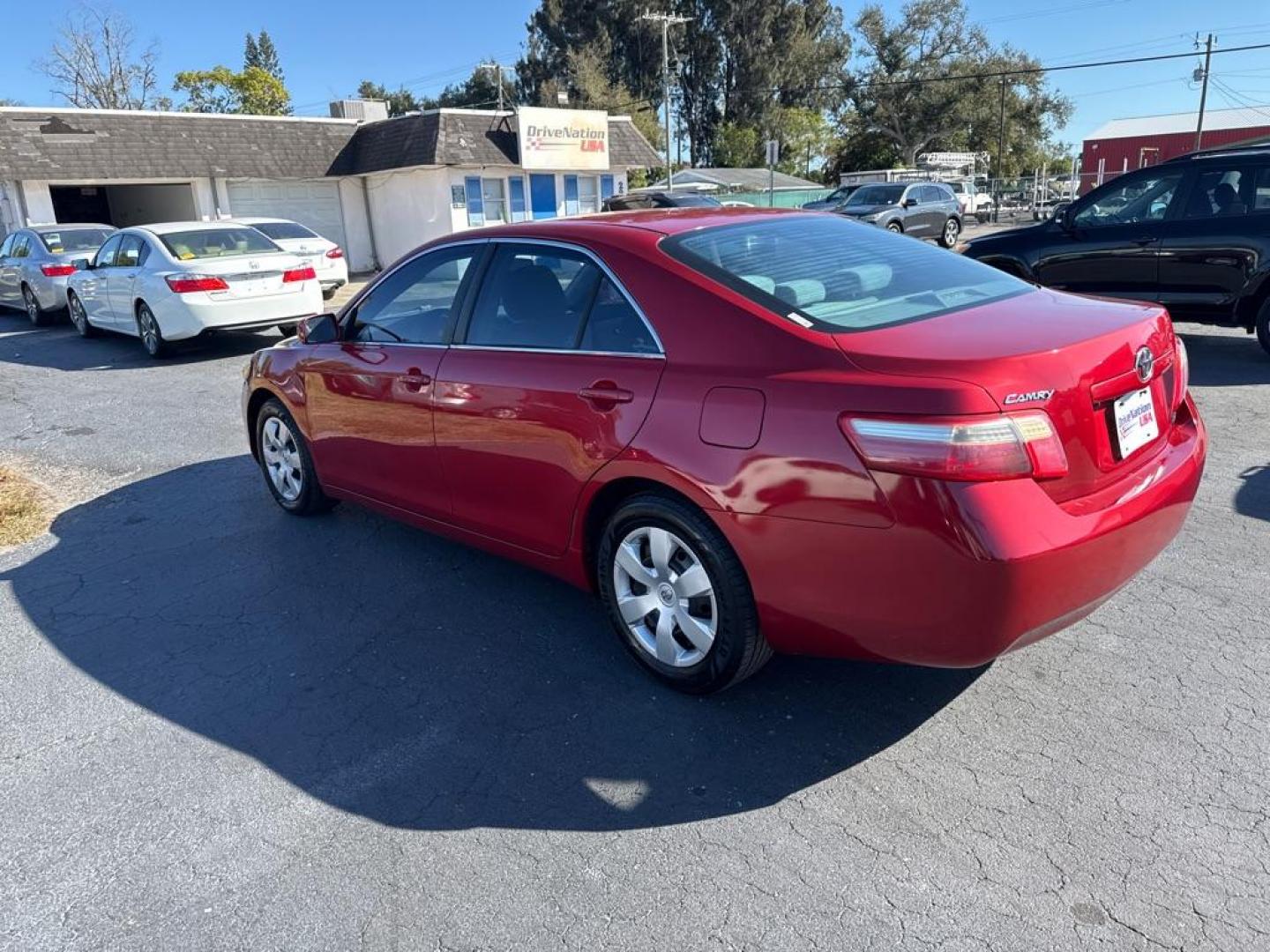 2009 RED TOYOTA CAMRY LE (4T1BE46K09U) with an 2.4L engine, Automatic transmission, located at 2929 9th St. West, Bradenton, 34205, (941) 242-2810, 27.473591, -82.570679 - Photo#4