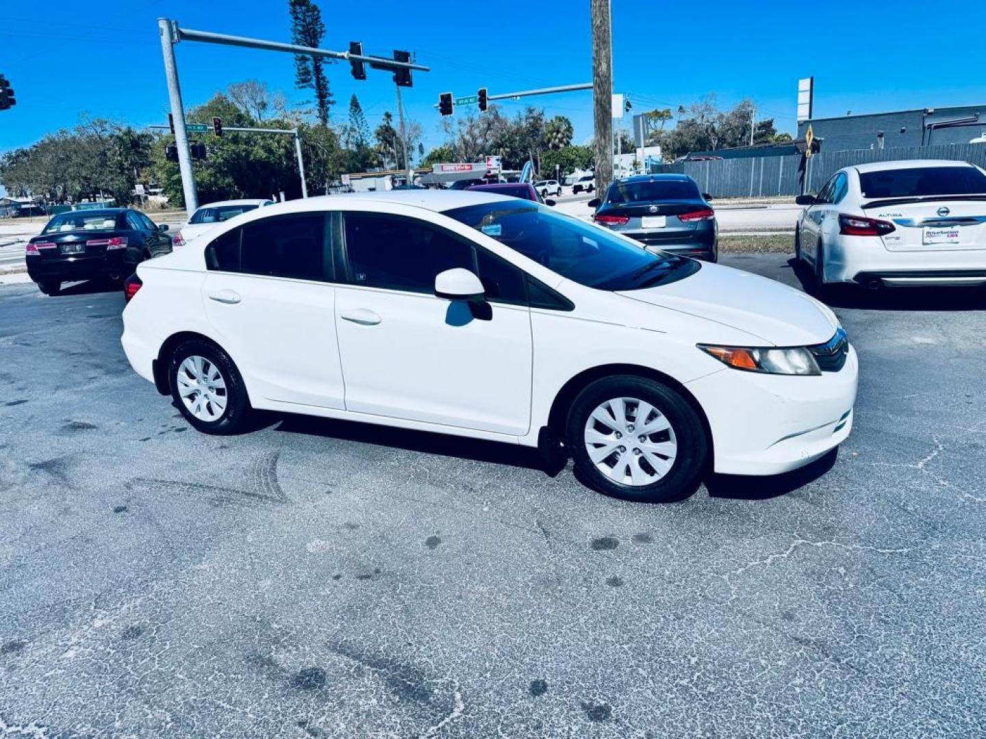 2012 WHITE HONDA CIVIC LX (19XFB2F52CE) with an 1.8L engine, Automatic transmission, located at 2929 9th St. West, Bradenton, 34205, (941) 242-2810, 27.473591, -82.570679 - Thanks for inquring into DriveNation USA! All vehicles listed can be viewed at www.drivenationusa.com for vehicle history reports and additonal info. We cannot quote any terms such as down payments or monthly payments without an application. You can apply directly at www.drivenationusa.com or by con - Photo#0