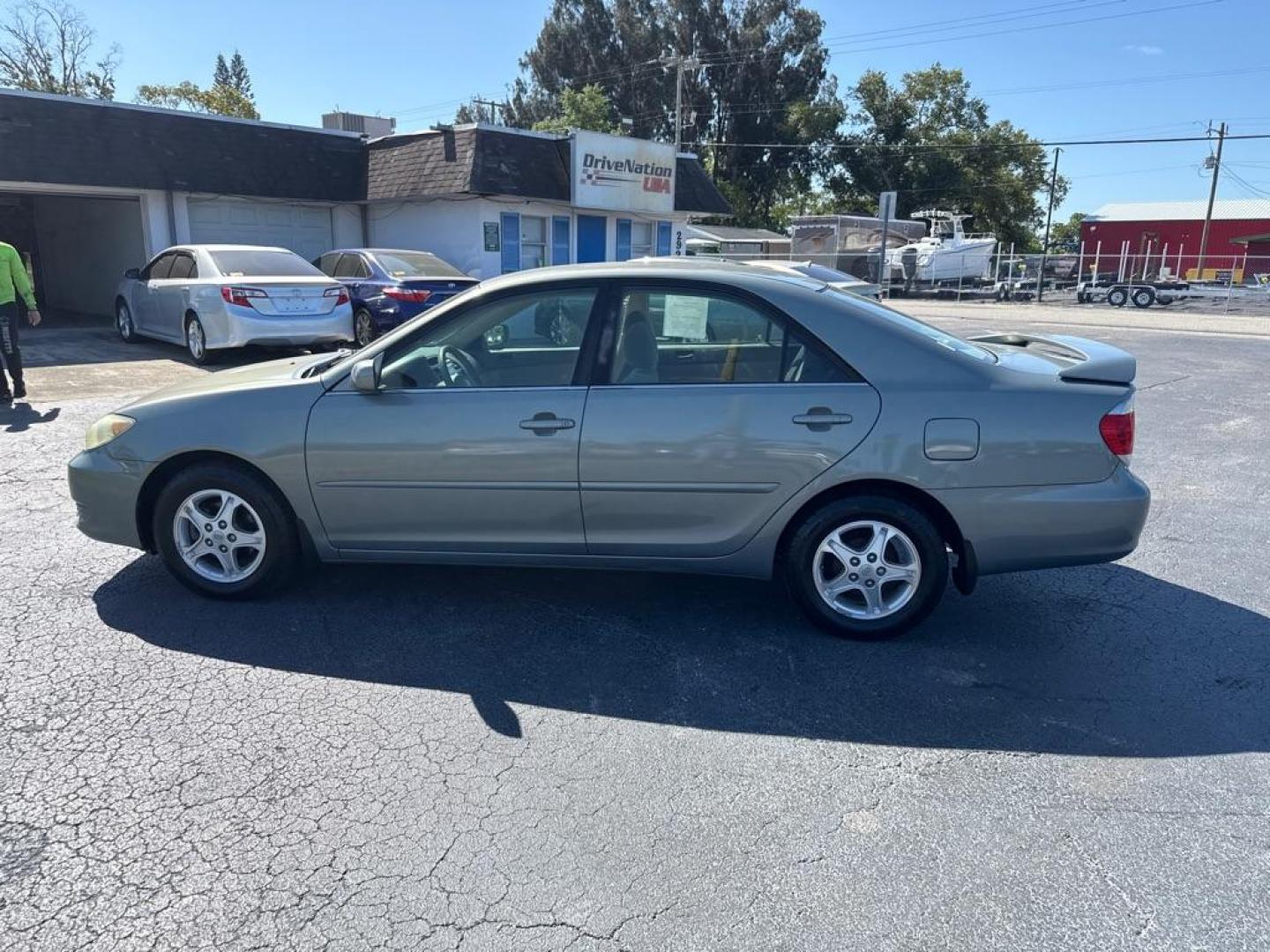 2005 GREEN TOYOTA CAMRY LE (4T1BE32KX5U) with an 2.4L engine, Automatic transmission, located at 2929 9th St. West, Bradenton, 34205, (941) 242-2810, 27.473591, -82.570679 - Thanks for inquring into DriveNation USA! All vehicles listed can be viewed at www.drivenationusa.com for vehicle history reports and additonal info. We cannot quote any terms such as down payments or monthly payments without an application. You can apply directly at www.drivenationusa.com or by con - Photo#4