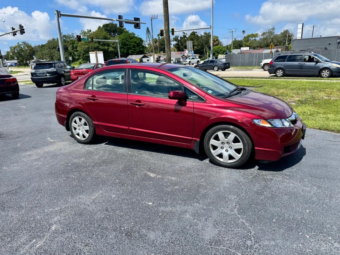 2009 RED HONDA CIVIC LX (2HGFA16599H) with an 1.8L engine, Automatic transmission, located at 2929 9th St. West, Bradenton, 34205, (941) 242-2810, 27.473591, -82.570679- Photo#0